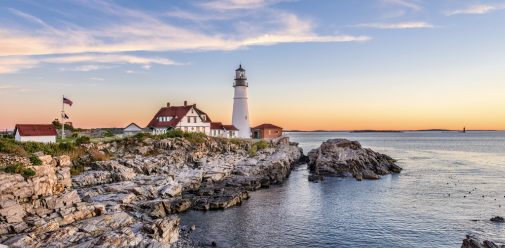 scenic Maine shoreline with lighthouse