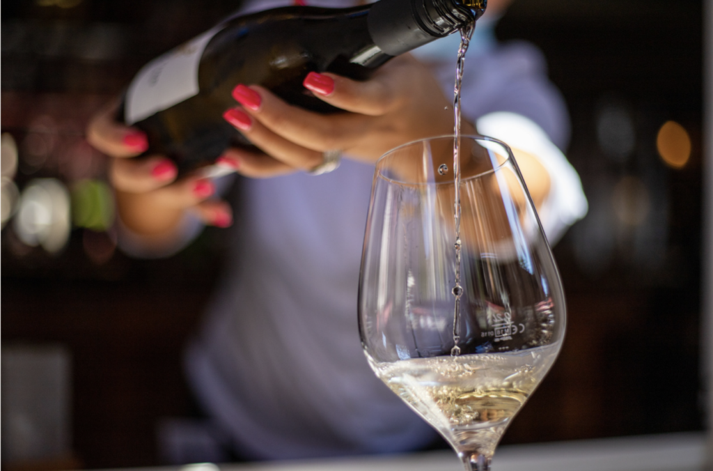 bottle of Pinot Grigio being poured