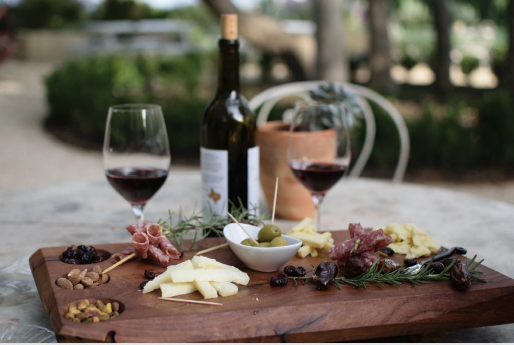 charcuterie board with red wine